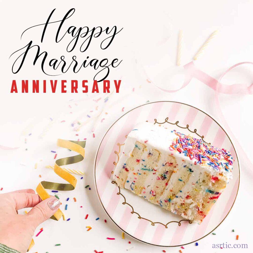 A slice of a delicious cake with colourful sprinkles on a plate with anniversary party decorations in the background