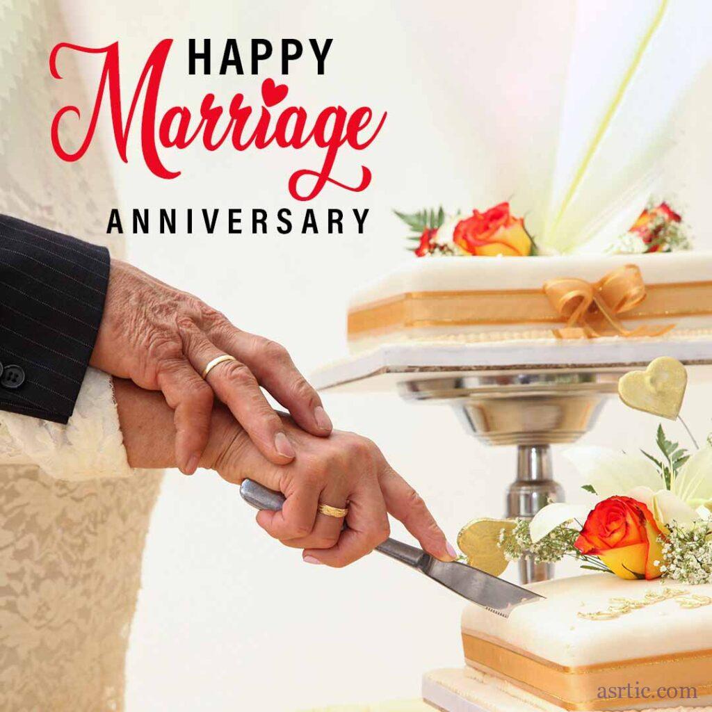 A three-tiered golden anniversary cake decorated with yellow and red roses on a white background with an old couple celebrating