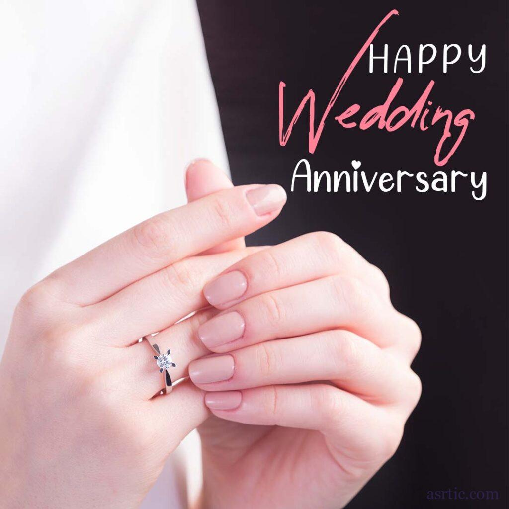 A picture of a diamond solitaire ring flashing on a finger to commemorate and show affection for a wedding anniversary