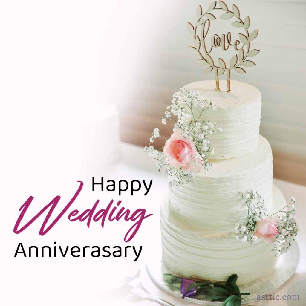 An image of cake with a Love Topper and Pink Rose Decorations on a White Background
