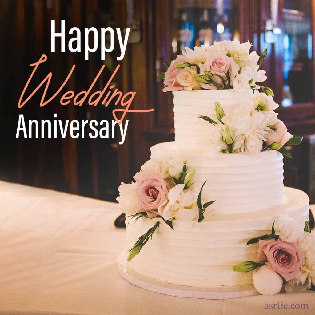 A beautiful and large wedding anniversary cake decorated with blossoms